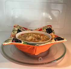 a bowl of soup is sitting in an oven