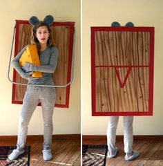 a woman standing in front of a cardboard box with mouse ears on her head and holding a piece of cheese