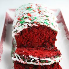 red velvet cake with white frosting and sprinkles