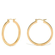 Coach Signature Hoop Earrings In Gold. New. Have Never Been Removed From Display Backing. 14kt Gold Over Brass 1 3/4” Hoop Earrings. Coach Engraved On Both Side Bottoms. Coach Round Jewelry For Anniversary, Everyday Gold Coach Jewelry, Coach Gold Jewelry For Anniversary, Gold Coach Jewelry For Anniversary, Coach Earrings, Coach Jewelry, Bar Stud Earrings, Halo Earrings Studs, Star Earrings Stud