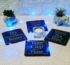 four coasters with lit candles on a towel