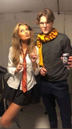 a man and woman are dressed up as harry potter and her hogwarts tie