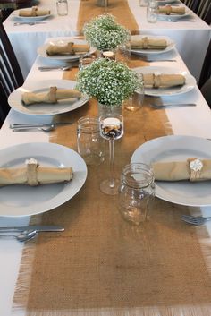 the table is set with place settings for dinner