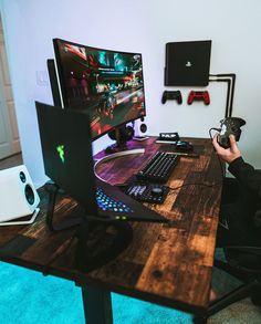 a person sitting at a desk with a computer on it