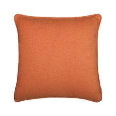 an orange pillow on a white background