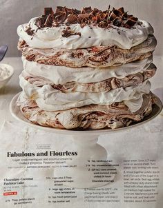 a cake with white frosting and chocolate shavings on top is featured in the magazine fabulous and flourless