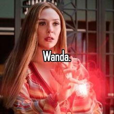 a woman with long hair holding a light in her hand and the words wandda on it