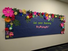 a bulletin board with flowers on it