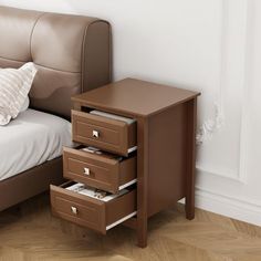 a bed sitting next to a brown leather headboard with drawers on each side and a white pillow