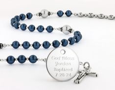 This baptism boy rosary makes a one of a kind baptism or christening gift.  The catholic rosary beads are available with or without a Name in the 3rd decade and with or without an Engraved Disc.  The rosary is made with the Finest European-made Crystal Pearls and it comes with your choice of a gift message that is elegantly boxed for simple gift giving. Add a Name in Beads - No name ships in 1-2 days/Yes Name ships in 2-4 days - Enter a name that is 10 characters or less.  The name will be placed in the middle of the rosary. Add an Engraved Disc - Select a Disc Design option. - Select a Disc Design from photo 5.  Enter the Disc Design # followed by the name you would like engraved and the date if applicable.  VERY IMPORTANT: This disc is attached with an open jump ring (Not soldered closed Beaded Rosary For Baptism, Rosary Bracelet With 8mm Round Beads For Baptism, Personalized Rosary With Round Beads For Baptism, Personalized Rosary For First Communion, Personalized Adjustable Rosary With Round Beads, Personalized Rosary, Disc Design, Simple Gift, Rosary Beads Catholic