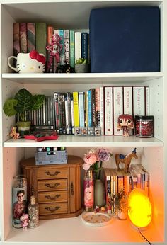 a book shelf filled with books and other items