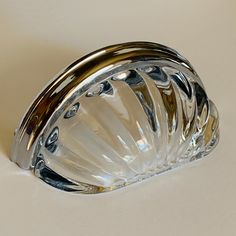 a clear glass object sitting on top of a table