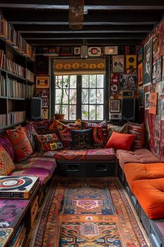 a living room filled with lots of colorful furniture and bookshelves on the walls