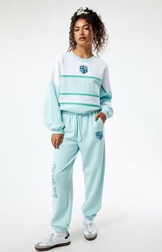 PacSun exclusive! Get ready to lounge in style with the Malibu LA Sports Club Sweatpants from Barbie. These sweatpants feature an interior drawstring waistband and side hand pockets for added convenience. Finished with Barbie embroidery and elastic ankle cuffs, they offer both comfort and a touch of sporty chic.


	Solid color sweatpants
	Soft fleece lining
	11.75" rise
	29.5" inseam
	10" leg opening
	High-rise
	Interior drawstring waistband
	Side hand pockets
	Barbie embroidery
	Elastic ankle cuffs
	60% cotton, 40% polyester
	Machine washable
	Model is wearing a size small
	Model measurements: 5’6” height, 30” bust, 25.5” waist, 36.5” hip Barbie Embroidery, Bershka Outfit, Barbie Malibu, Sports Club, Sports Clubs, Ankle Cuffs, Sporty Chic, Womens Loungewear, Drawstring Waistband