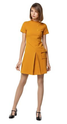 SALE!  A classic sixties aesthetic; autumn dress with fitted torso, front pleat, a-line skirt, functional pocket, 5 button decorative detailing, stand away collar, beautiful topstitching & short sleeves. Choose bespoke for any length of sleeve or hem or to alternate colour. Please feel free to contact us for colour Sixties Aesthetic, Mustard Yellow Dress, Mustard Yellow Dresses, Vestidos Retro, Angie Dickinson, Dress With Pleats, Aesthetic Autumn, Look Retro, 1960's Dress