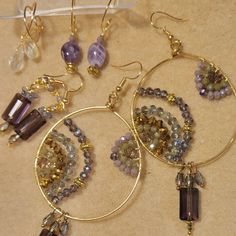 Stunning Amethyst Crystals & Gemstone Earrings, Large Gold Plated Hoops Have Stacked Crystals In Center With Faceted Rectangle Amethyst Stone Dangling With Small Teardrop Swarovski Briolettes, Another Pair Has Just The Stones Dangling From Gp Earwires, There's 2 Daily Hoop Huggers, One With Amethyst Gemstones The Other With Crystal Swarovski Briolettes. All Are Stunning! See Pics For Size Ear Art, Crystals Jewelry, Amethyst Crystals, Earring Bundle, Earring Ideas, Wrap Jewelry, Diy Crystals, Wire Work, Gift Jewelry