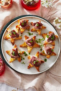 small appetizers are arranged on a white plate