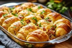 a casserole dish filled with meat and cheese