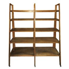 a wooden shelf with three shelves on each side