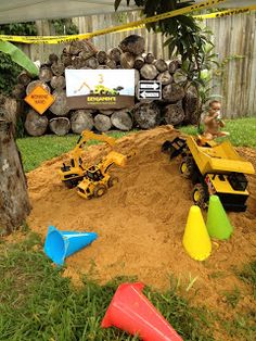 the construction site is set up in the yard for children to play with their toys