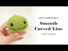 a hand holding a small green crocheted smiley face ball with the text how to embroider a smooth curved line