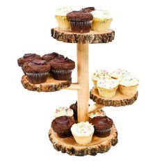 cupcakes and muffins are arranged on three tiered wooden stand