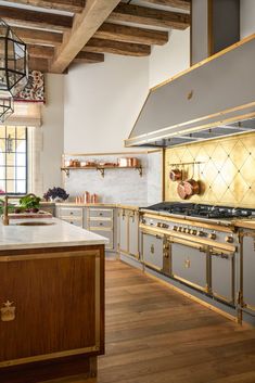 a kitchen with an oven, stove and counter tops in it's center island