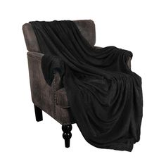 a chair with a black blanket on it