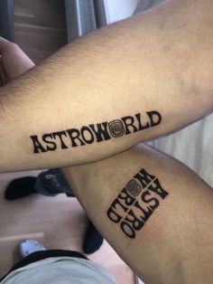 two people with tattoos on their arms that say astroworld and the words from gravity