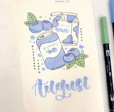 a notebook with an image of a blueberry drink and the words august on it