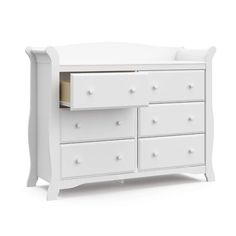 a white baby crib with drawers on it