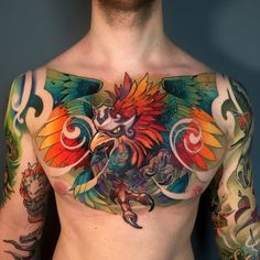 a man with many tattoos on his chest