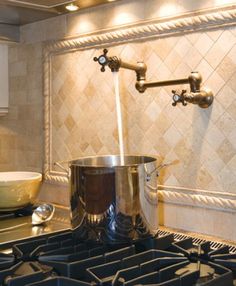 a kitchen with a pot on the stove