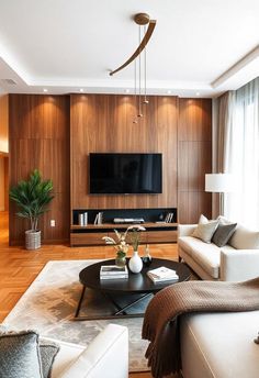 a living room filled with furniture and a flat screen tv mounted on a wall above a fireplace