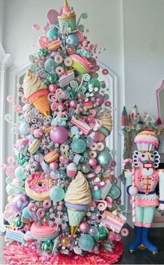 a colorful christmas tree decorated with buttons and candy