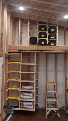 an unfinished room with shelves and tools in it