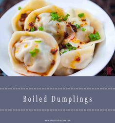 some dumplings are on a white plate with green garnish and text that reads boiled dumplings