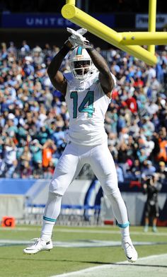 a football player catching a ball in the air