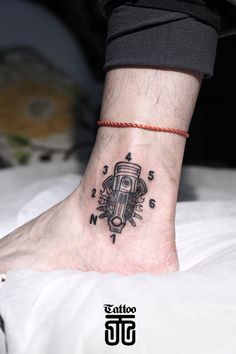 a person with a small tattoo on their foot