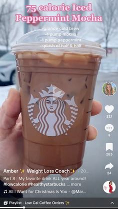 someone holding up a cup of iced coffee in front of a parking lot with the text, 75 calorie iced peppermint mocha