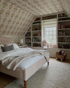 a bedroom with a bed, bookshelf and window in the ceiling is featured on instagram