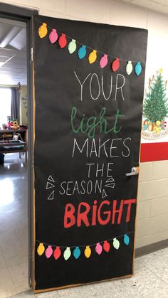 a blackboard sign that says your light makes the season bright