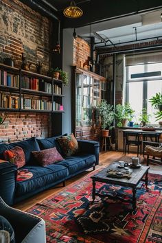 a living room filled with furniture and lots of bookshelves next to a window