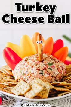 a turkey cheese ball on a plate with crackers