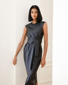 A sleek and modernized take on the LBD — this vegan leather dress is perfect for the office layered over a long-sleeve tee or on its own for date night. See below for our general Size Guide and available measurements Made of polyester, lining made of polyester Machine wash cold separately, tumble dry at low temperature, cool iron as needed Tie Front Dress, Faux Leather Dress, Leather Dress, The Office, Date Night, Size Guide, Vegan Leather, High Neck Dress, Long Sleeve Tees