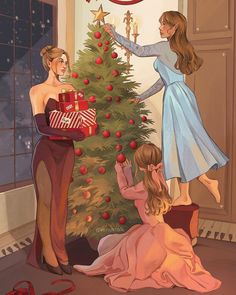 two women are decorating a christmas tree