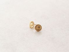 Our Sunflower earrings come in either silver or gold and make the best compliment to our new Daisy Chain. Made with 14k gold over stainless steel makes these both hypoallergenic and waterproof. Earrings are packaged into our Tom Design logo stamped boxes, perfect for gift giving. Measures about 10mm in diameter. Gift Gold Flower Earrings Tarnish Resistant, Gold Tarnish-resistant Flower Earrings Perfect For Gifts, Gold Tarnish-resistant Flower Earrings For Gift, Dainty Yellow Gold Flower Earrings For Gifts, Anniversary Gold Jewelry With Sunflower Design, Small Gold Earrings For Gift, Gold Earrings For Gift, Yellow Gold-plated Flower Earrings For Gift, Gold Hypoallergenic Flower Earrings For Anniversary