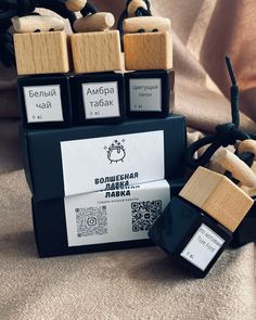 three wooden blocks sitting next to each other on top of a cloth covered tablecloth