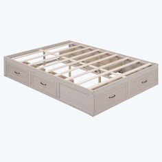 a bed frame with two drawers on each side