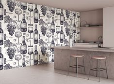 a kitchen with two bar stools next to a counter and wallpaper that has wine bottles on it